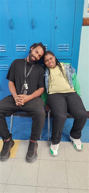 Father and daughter with to speak with teacher